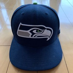 Seattle Seahawks fitted hat. Size 7 1/4. Lightly used, good condition.